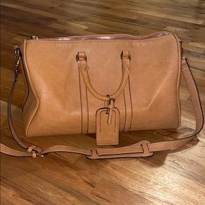 Brown small duffel bag